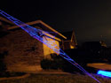 Side view of a GIANT GlowWeb under black light image